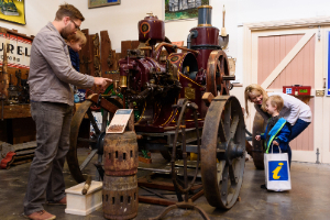 Family looking at a tractor in the Museum