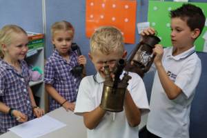 School children examining historical items